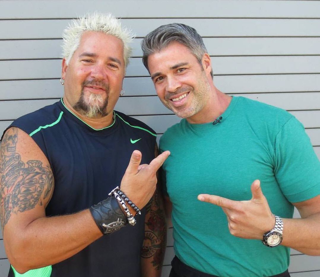 Marcel with Guy Fieri on Guys Grocery Games on the Food Network